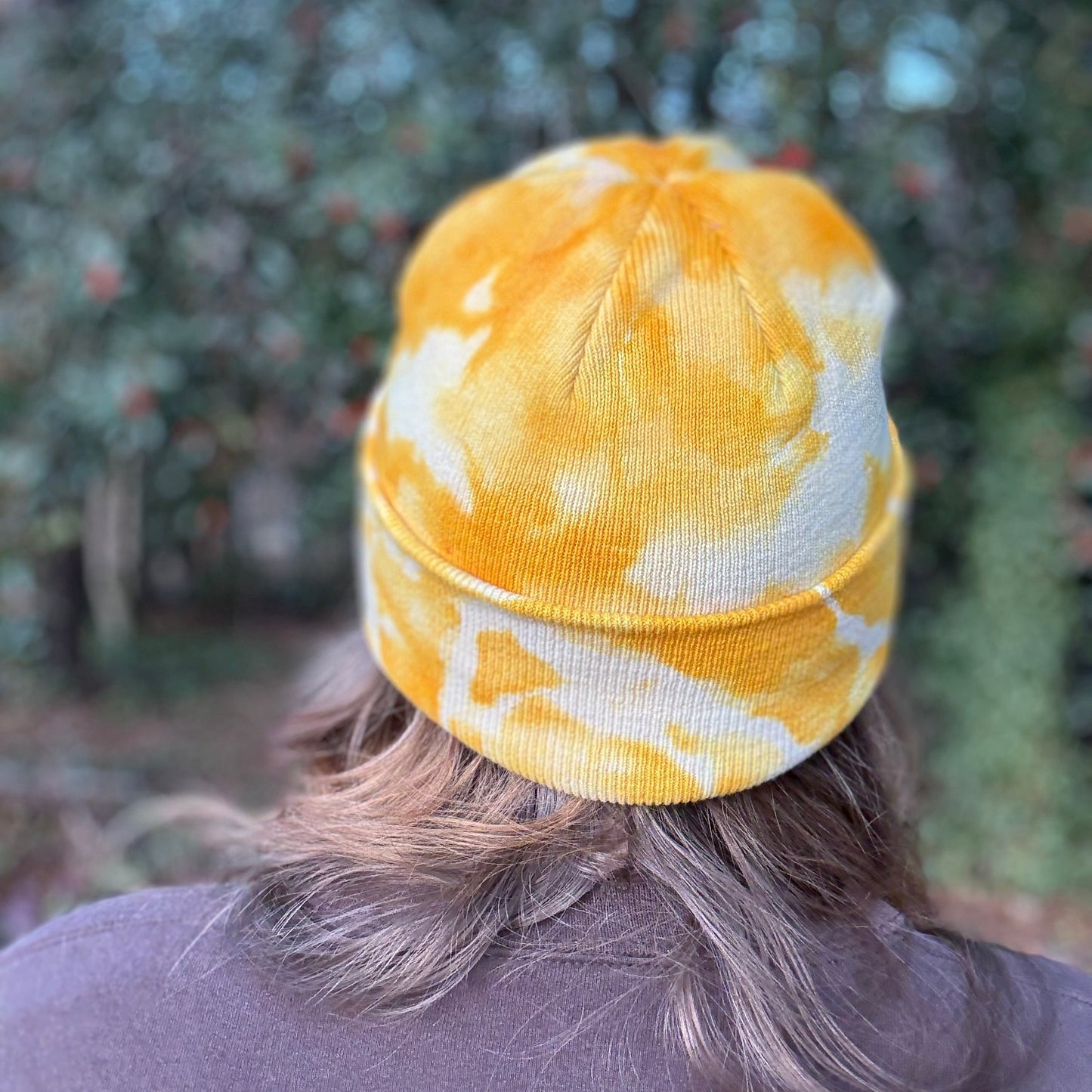 Back of yellow tie dye beanie